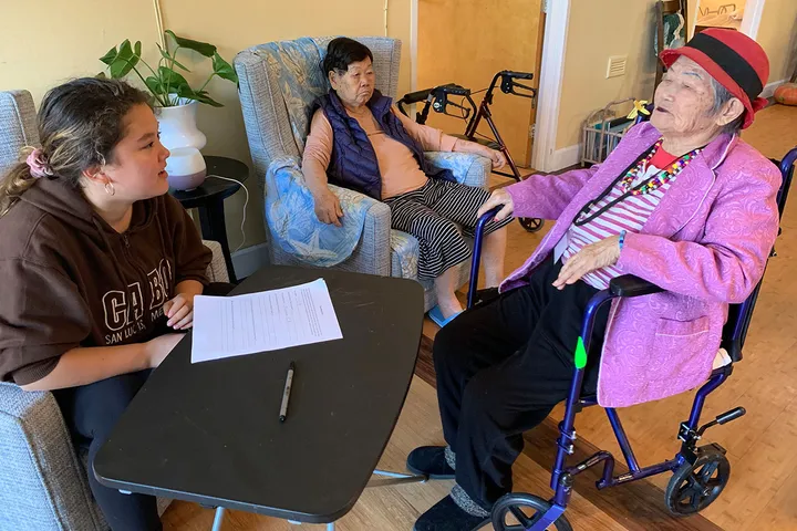 Residents and visitors spending time together around a table