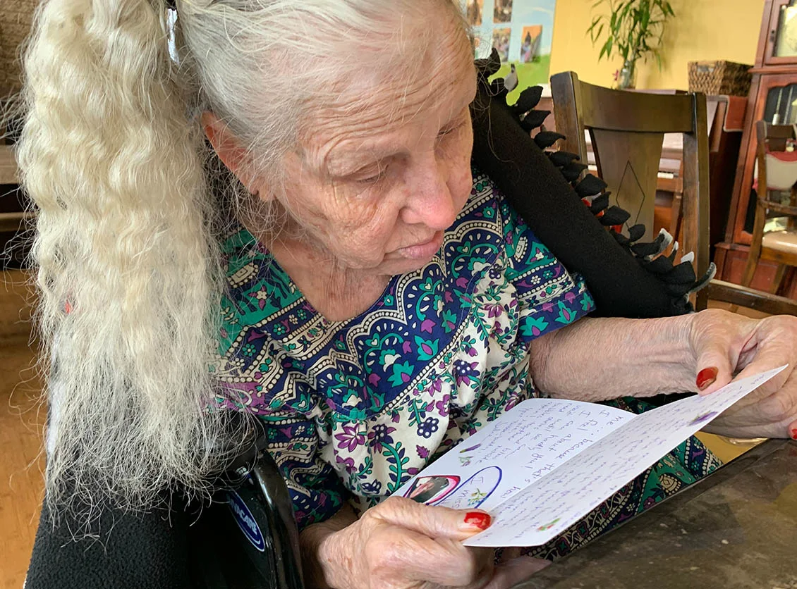 A Dimond Care resident enjoying a quiet moment with a book